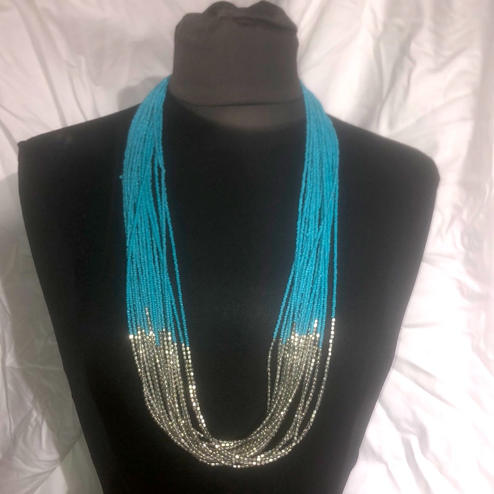 Long beaded turquoise and silver tone necklace